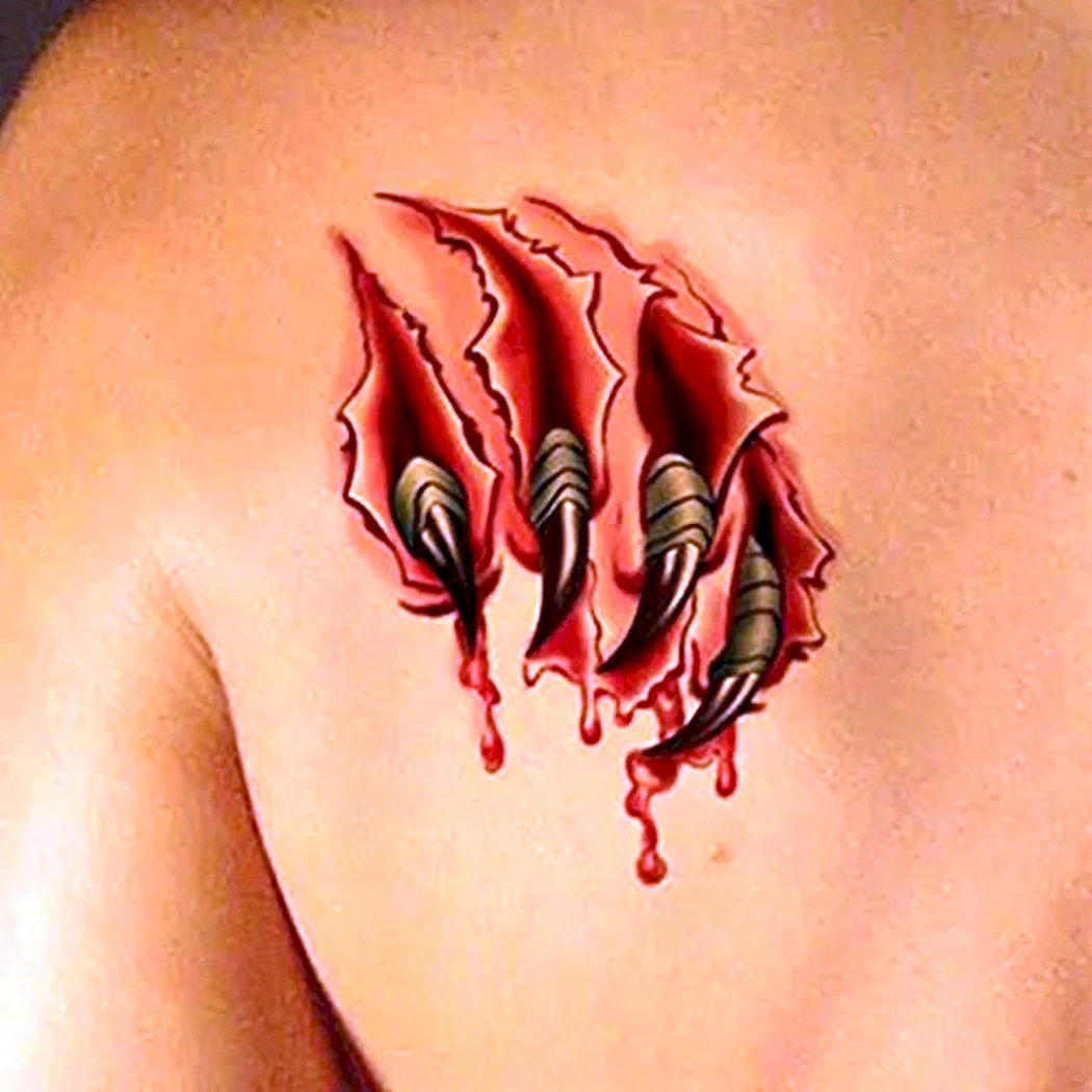Тату в виде рваной раны