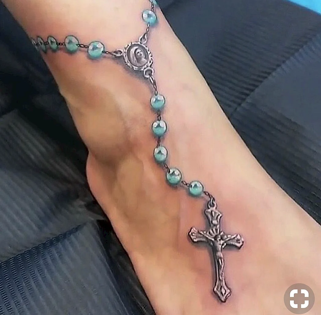 Тату четки с крестом на ноге